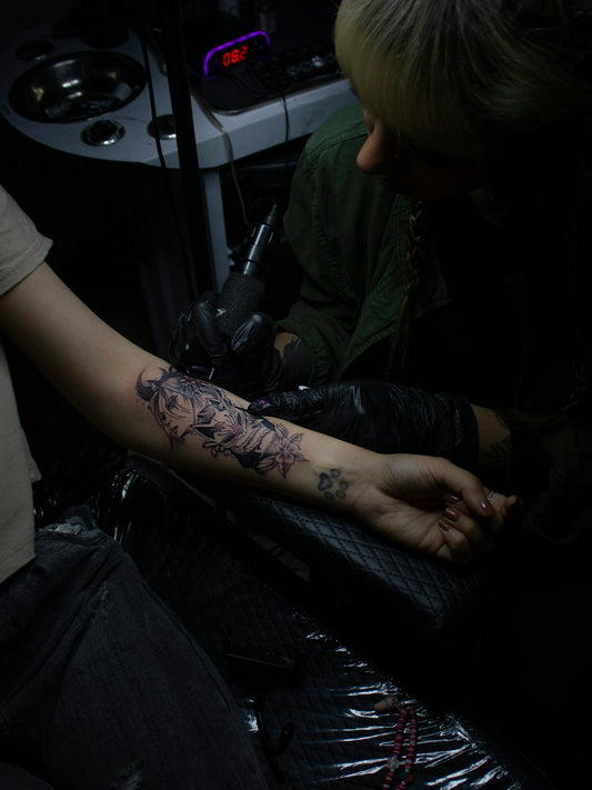 a woman with a tattoo on her arm