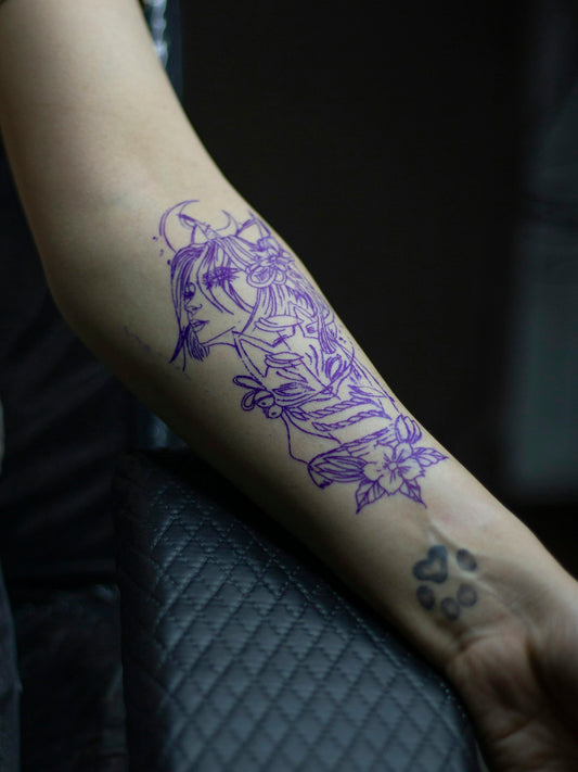 a person with a tattoo on their arm