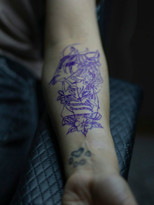 a person with a tattoo on their arm